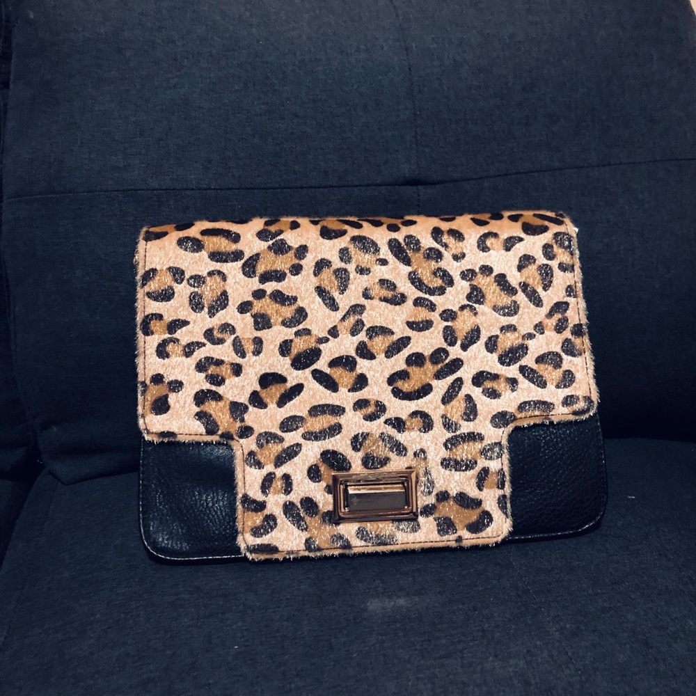 Leopard and plain clutch